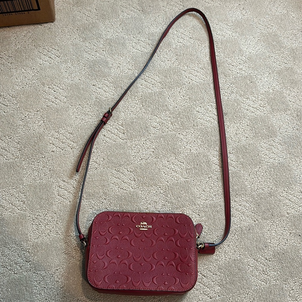 brand new little maroon coach bag